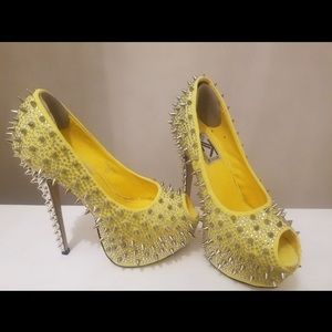 Yellow spiked heels